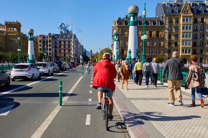 a group of people walking on a city street