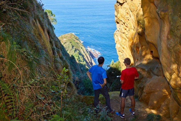 a man standing on a rocky hill