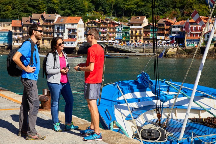 a group of people standing on a dock
