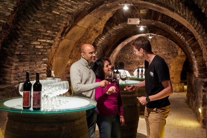 a man and a woman standing in front of a building