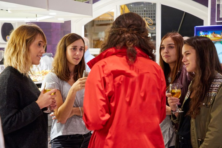 a group of people standing next to a person