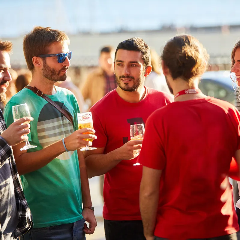 a group of people standing around each other